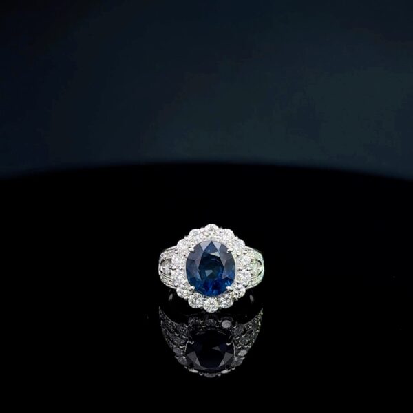 Single halo blue sapphire ring